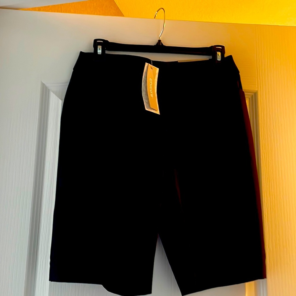 Black zip up shorts.